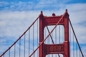 Top of Golden Gate Bridge zoom shot with cloudy blue sky