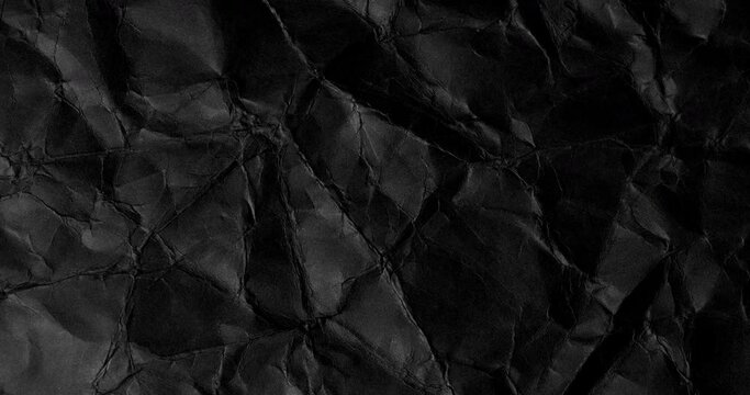 Black crumpled texture surface seamless loop rotating. Used as a background and texture.