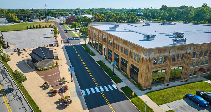 Corner view of ACD Automobile Museum with parking lots on bright sunny day aerial