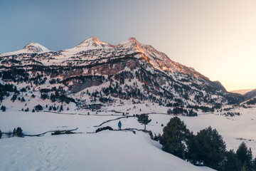 Mountainous winter landscape with anonymous person