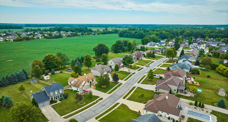 Aerial rural neighborhood with farmland between neighborhoods