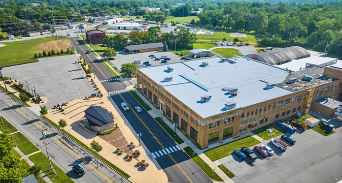 ACD Automobile Museum entrance with parking lots on bright sunny day aerial