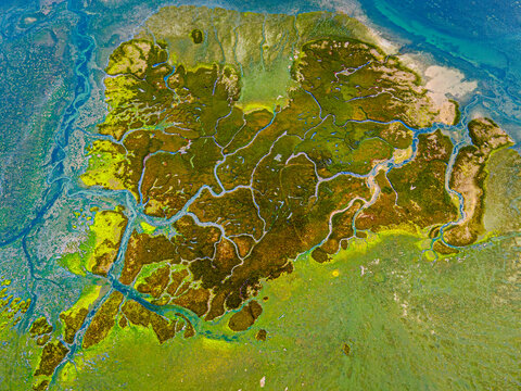 Overhead capture of colorful marsh with blue channels
