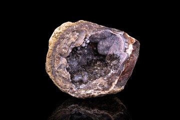 calcite druse isolated on black background. macro detail close-up rough raw unpolished semi-precious gemstone