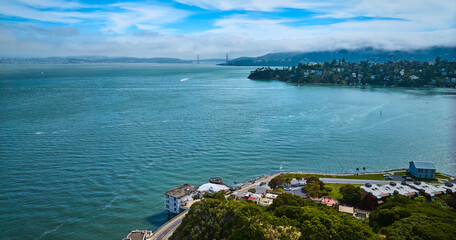 Aerial Tiburon waterfront properties overlooking San Francisco Bay with Golden Gate Bridge
