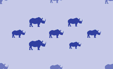 Seamless pattern of large isolated blue rhino symbols. The pattern is divided by a line of elements of lighter tones. Vector illustration on light blue background
