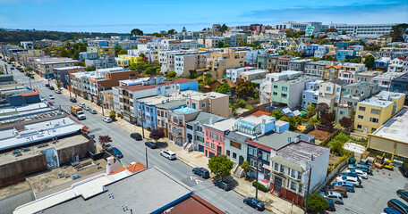 Aerial residential area of San Francisco on blue sky day with soft purple clouds