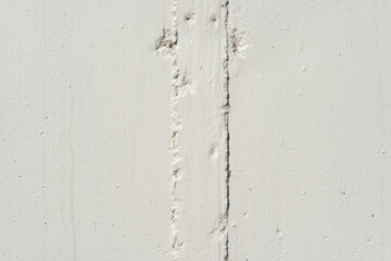 thick concrete wall with stripe element painted gray