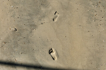 Footprints left in the sand on the beach in Arcachon, France
