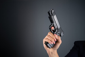 Woman holding a gun - Powered by Adobe