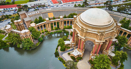 Palace of Fine Arts open air rotunda and colonnade around lagoon in downward aerial