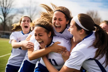 Fotobehang Group of young female soccer players celebrating victory © Adriana