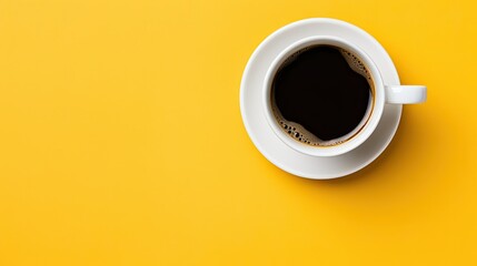 hot espresso on yellow table with soft focus and backlighting. top view