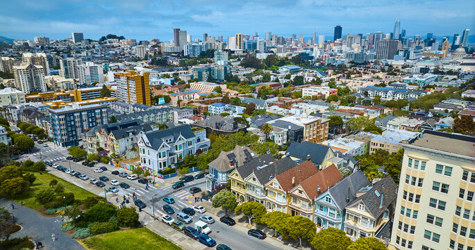 Aerial The Painted Ladies houses with wide view of San Francisco