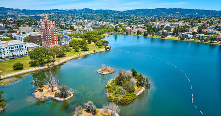 Fototapeta na wymiar Pelican Island on Lake Merritt with aerial of Oakland City residential area