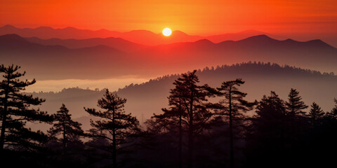 Sundown over mountain range, fiery orange and red sky, silhouettes of pine trees, wisps of fog, telephoto lens
