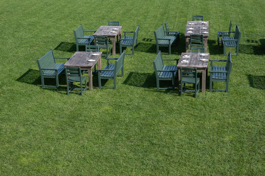 Outdoor seeting on a green grass lawn on a sunny day.