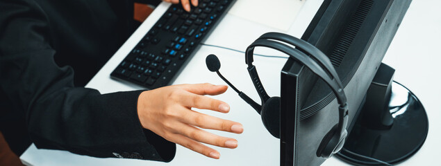 Business people wearing headset working in office to support remote customer or colleague. Call...