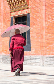 Dakshinkali, Nepal, 10-10-2023: a tibetan monk at the monastery of Guru Rinpoche (Padmasambhava), tantric Buddhist Vajra master, built in 2012, overlooking Dollu and Pharping monasteries