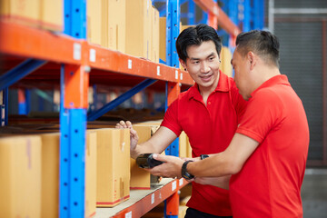 workers using barcode scanner in the warehouse storage