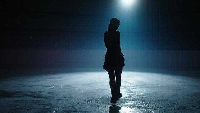 Sport And Success, Female Silhouette On Ice Rink In Darkness, Figure Skater Woman Jumping