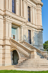 Curved steps leading up to front entrance of modern castle like building