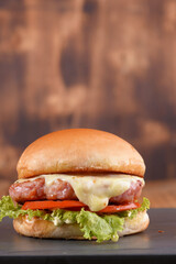 sandwich with beef burger on brioche bread salad egg and bacon street food fast food