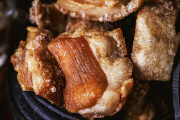Brazilian crackling, an appetizer made by frying bacon, a layer of leather, meat and lots of fat,...