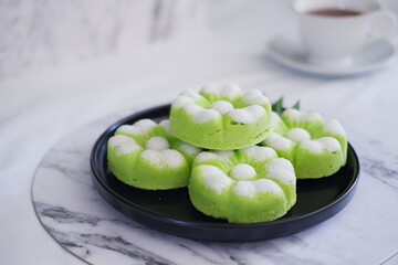 Kue Putu Ayu, a traditional Indonesian snack made from rice flour, pandan leaves, grated coconut then steamed.