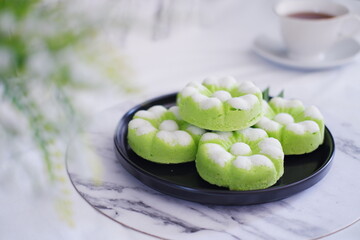 Kue Putu Ayu, a traditional Indonesian snack made from rice flour, pandan leaves, grated coconut then steamed.