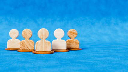 Five wooden figures as people icons on a blue stage, teamwork and community theme, 3d illustration