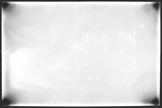 Vintage photo film frame of a middle format camera,  transparent background with dirty spots, film grain and vignetting (png image). Useful for old photo simulations, effects and template.