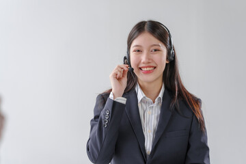 Female asian people call center representatives. Business individuals engrossed in conversations,...