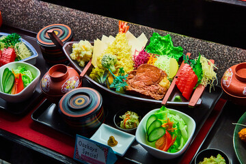Seafood and meat sushi boat Osakaya Special made with toy food items on display