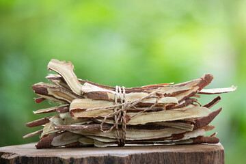 Licorice or Glycyrrhiza glabra dried slices on nature background