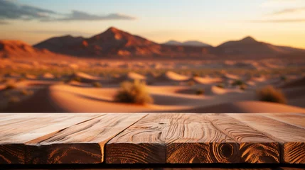 Fotobehang Wooden table top on blur desert background. For montage product display. View of copy space.  © artpritsadee