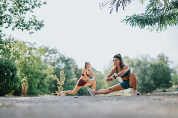 Fototapeta premium Fit Girls Strengthening Muscles and Increasing Flexibility in Nature