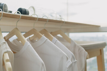 Hanging white clothes on the balcony in the apartment. Wash and laundry.