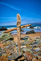 Motivational religious cross on colorful shore with gorgeous blue and purple sky