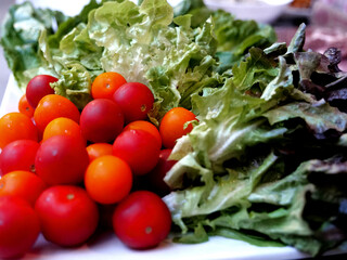 Close up fresh salad tomato green vegetables