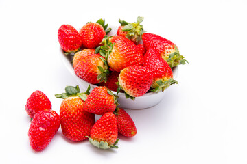 Strawberries in dish on white background with room for message