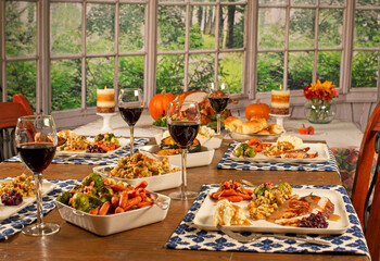 Thanksgiving dinner with all fixings and red wine, no people