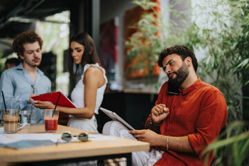The Creative Architectural Team Discussing Blueprint Details at an Outdoor Coffee Bar