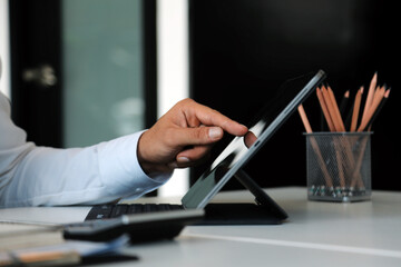 Close up of Business team analyzing income charts and graphs with modern laptop computer. Business analysis and strategy concept.