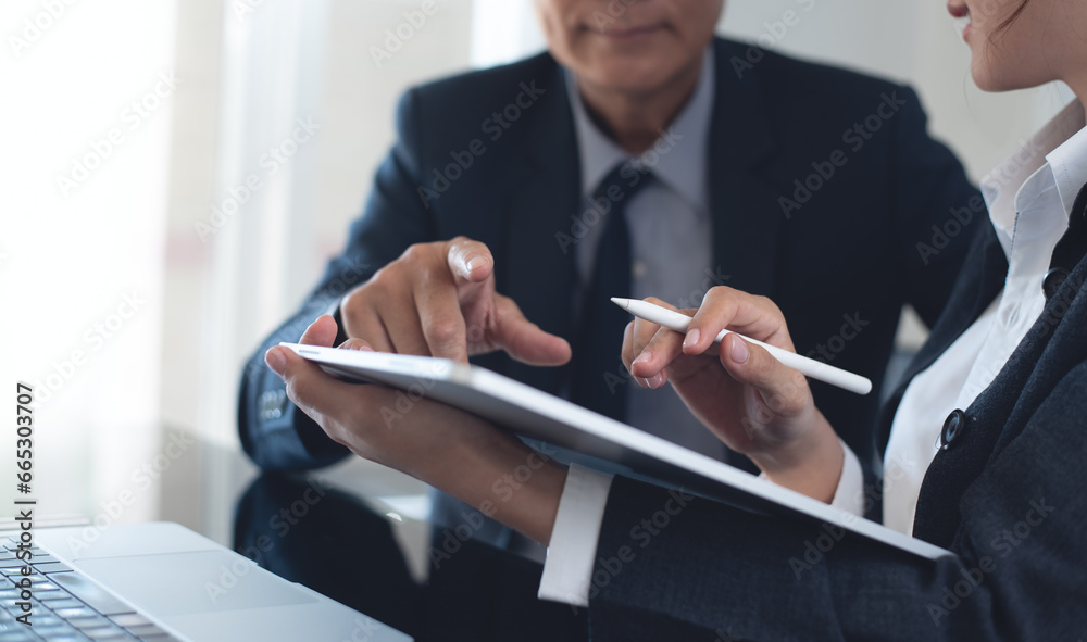 Poster two asian business colleague using digital tablet, working together. business team brainstorming, ha