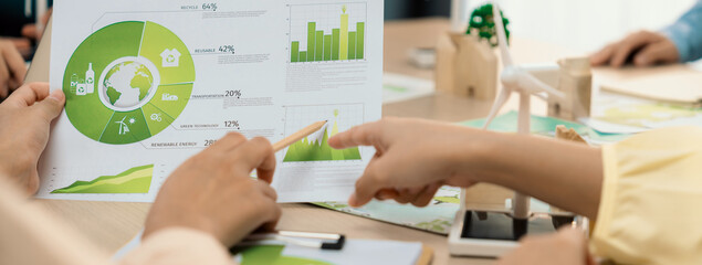 Professional businessman interested in invested in green businesses when he see rising graph on...