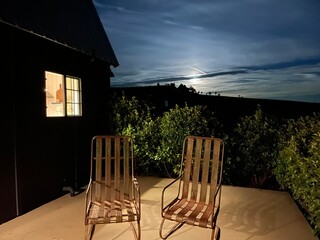 Vintage lawn chairs in the moonlight