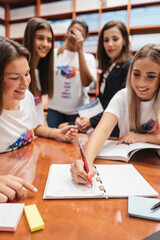 A vibrant campus library where professors and students collaborate on school projects, study...