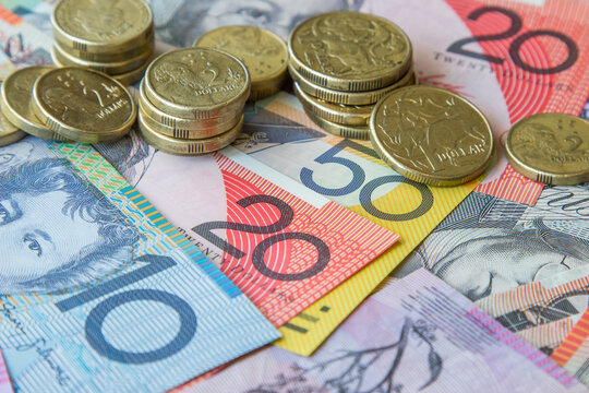 Australian coins sitting on notes