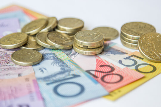 Australian coins sitting on notes